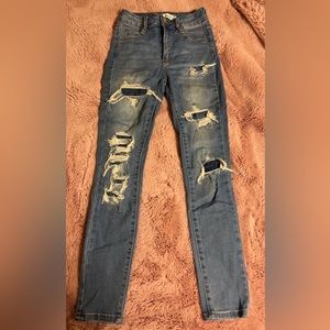 Ripped blue skinny jeans.